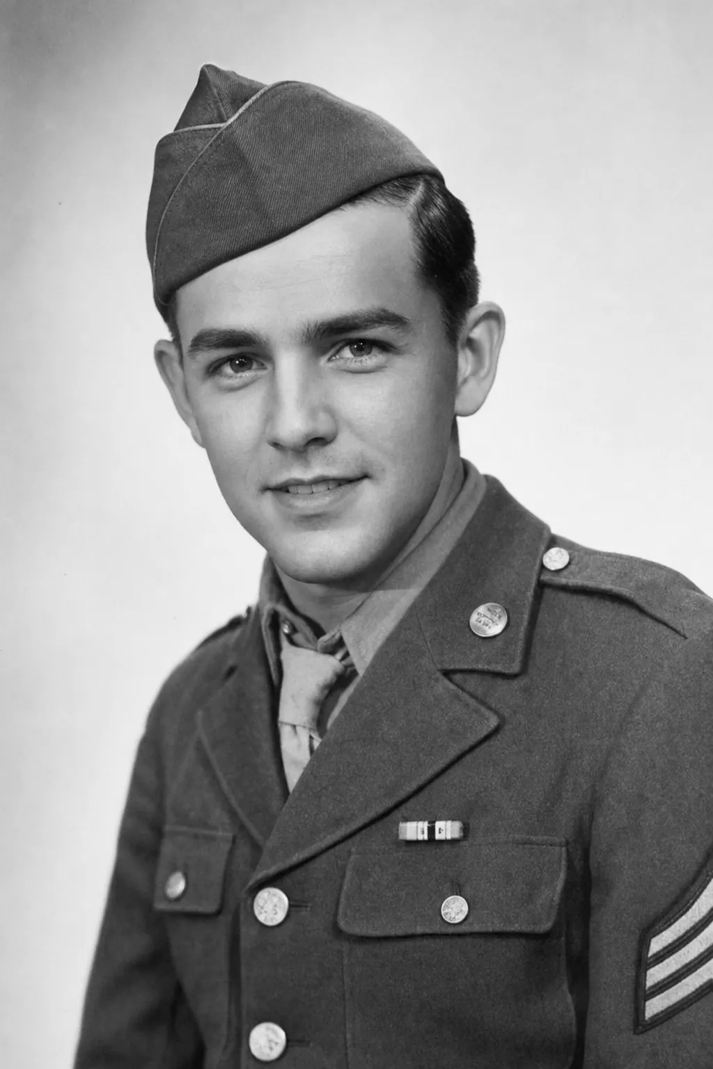 A restored 1944 soldier portrait in clean monochrome
