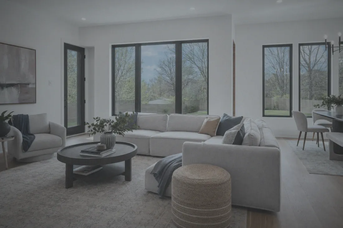 The same room before, dim with blown-out windows